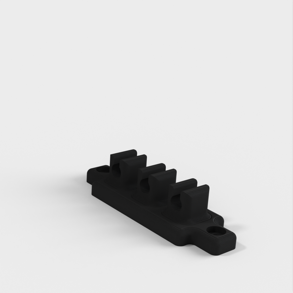 Cable holder for the desk or bedside table