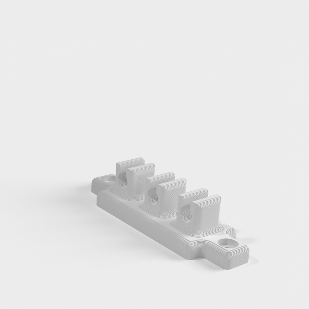 Cable holder for the desk or bedside table