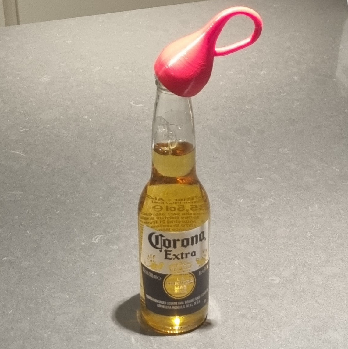 Klein bottle opener-shaped bottle opener