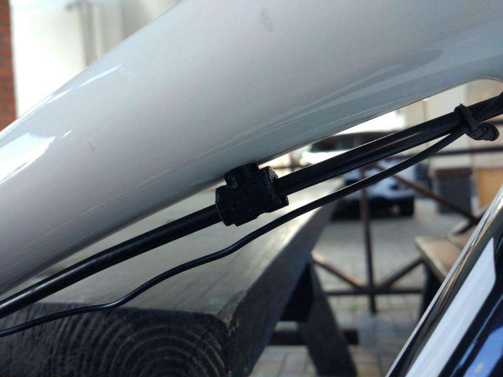 Brake pipe clamp and cable holder for bicycle