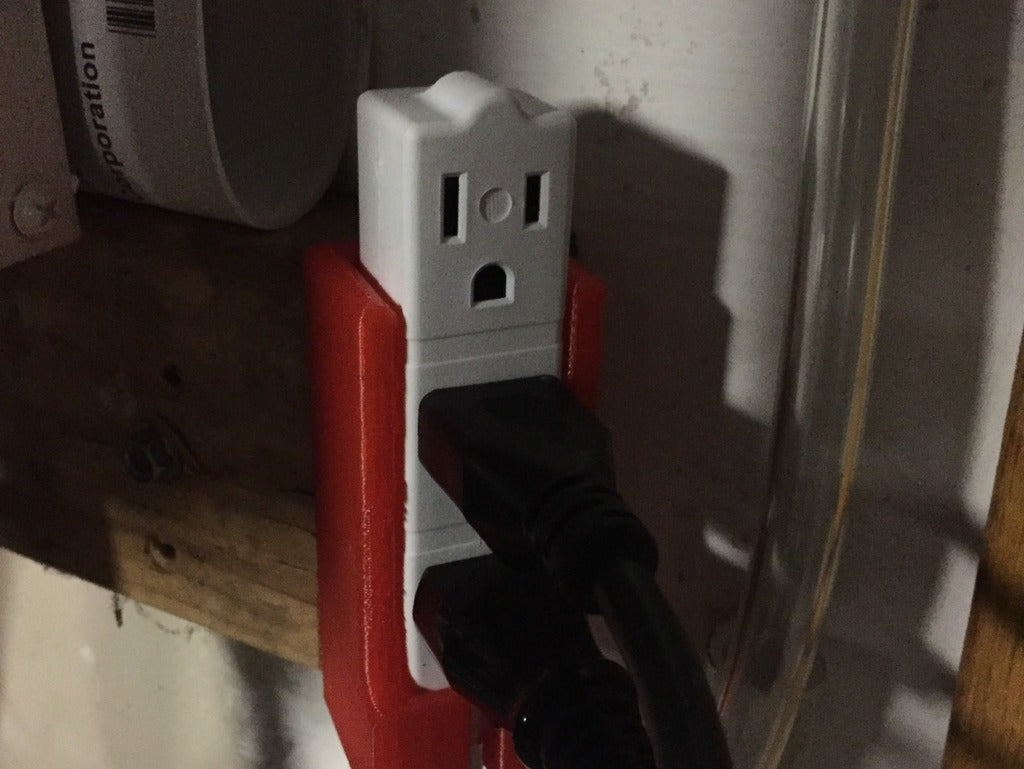 Wall-mounted extension lead holder