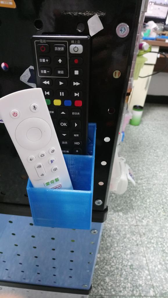 Magnetic remote control holder for TV