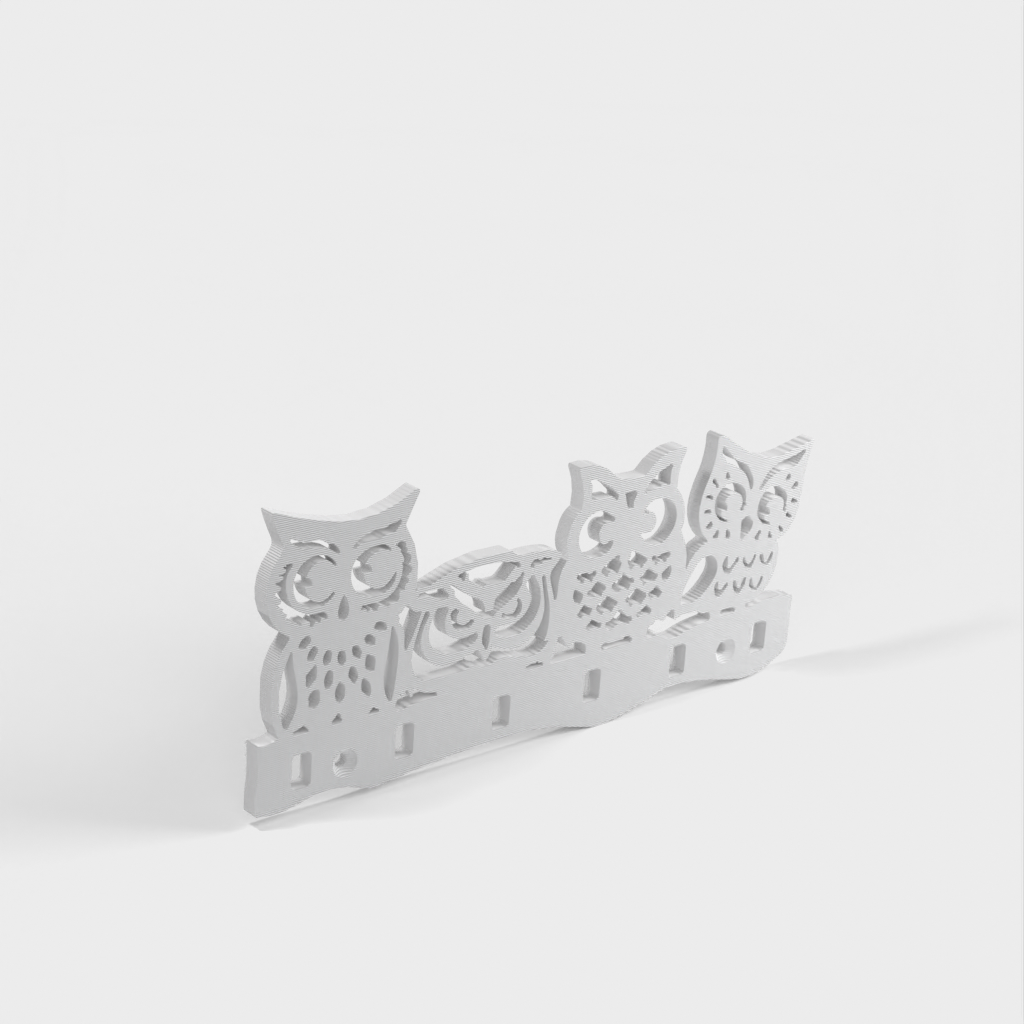 Wall-mounted key holder with owls