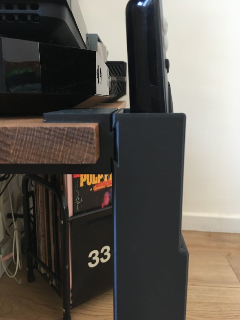 Remote control holder for 19mm shelf unit