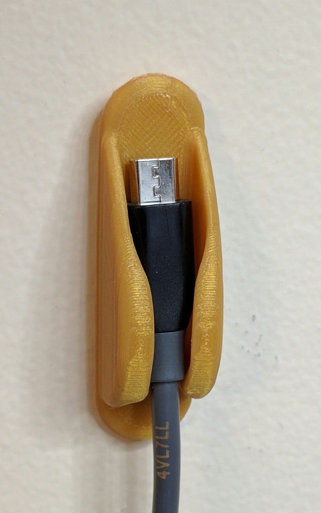 Practical wall holder for cables and USB wires
