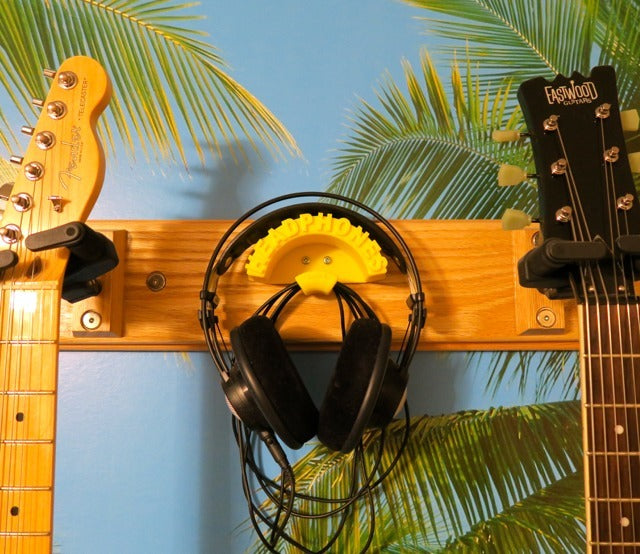 Wall mounted holder for headphones and cables