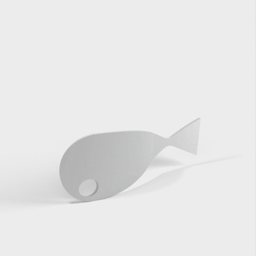 Fish-shaped spoon holder for stove top
