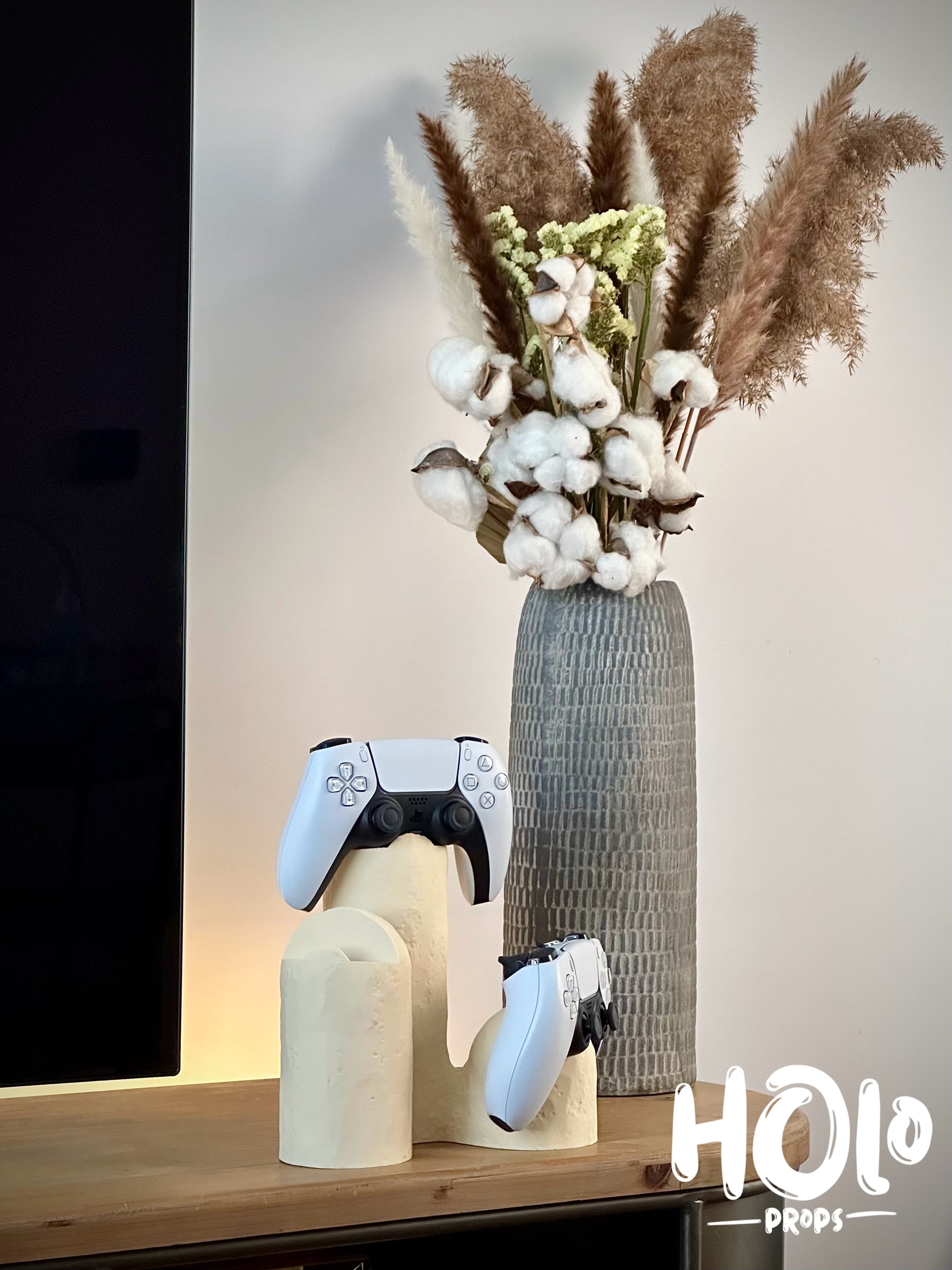 Modern stand for three PlayStation Xbox controllers