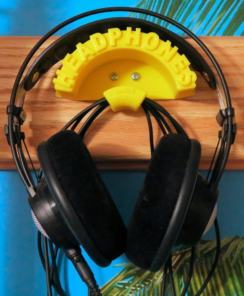 Wall mounted holder for headphones and cables