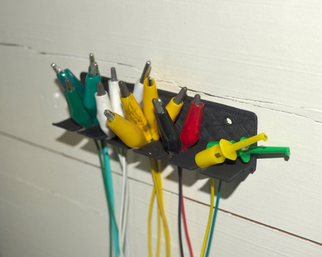 Wall-mounted measuring tape hooks