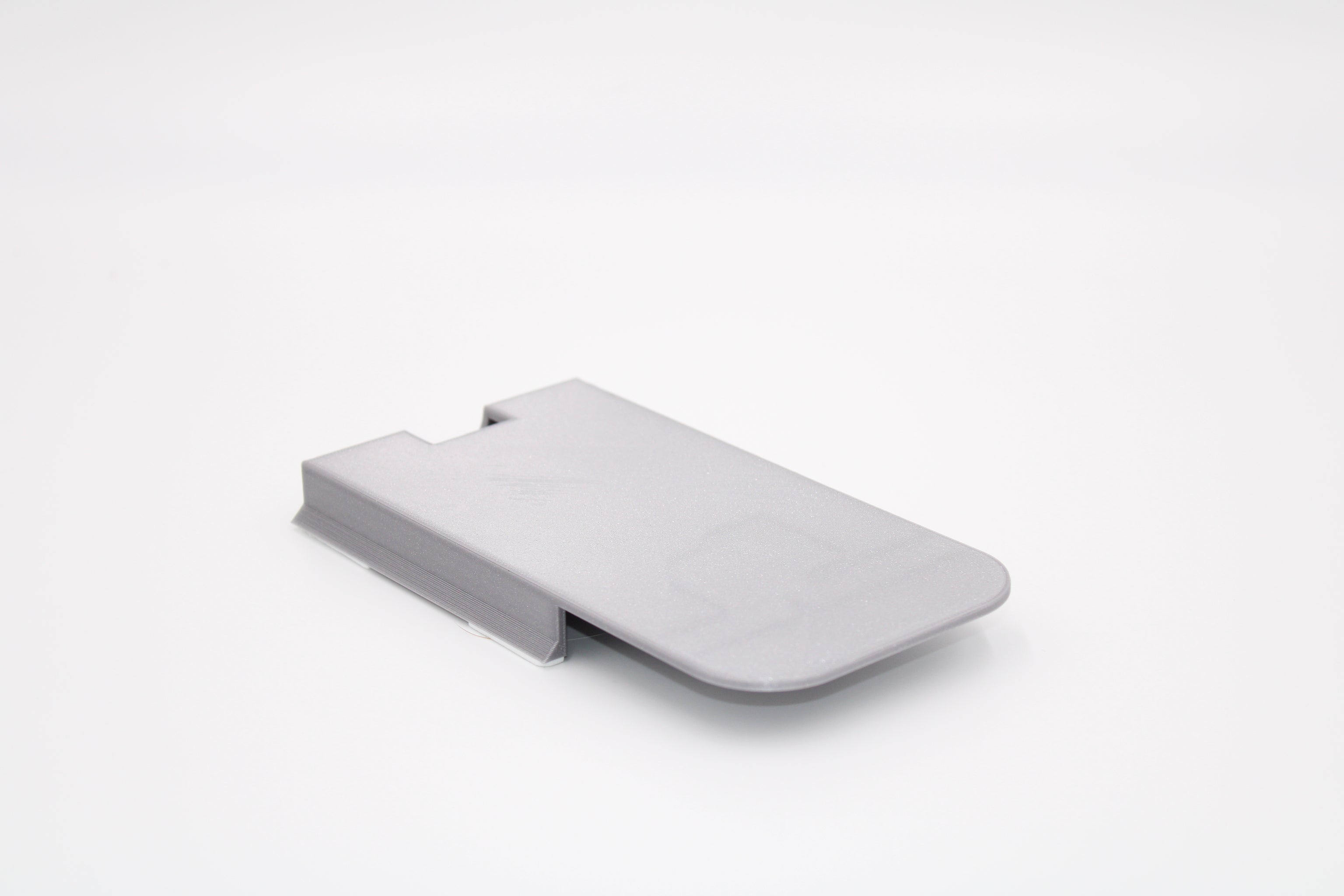 Phone holder for the underside of the desk