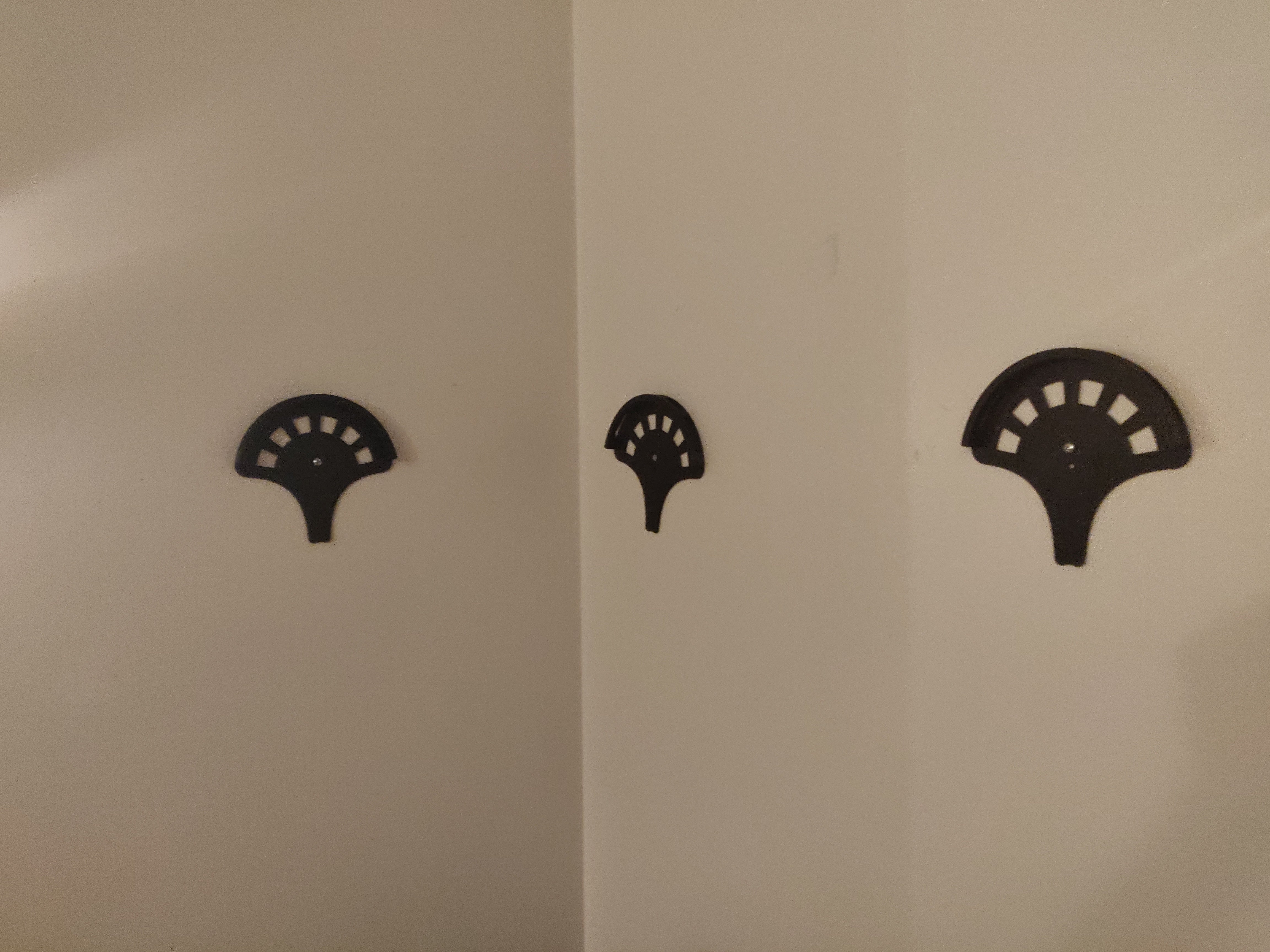 Wall mounted cap holder