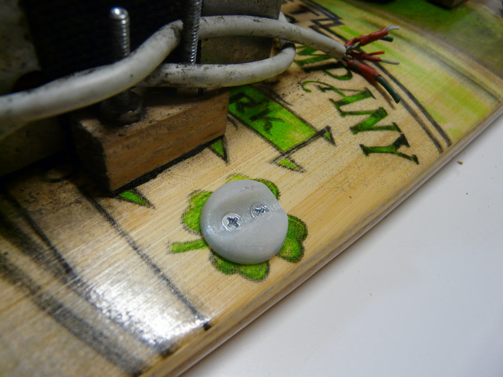 Cable clip with screw holes