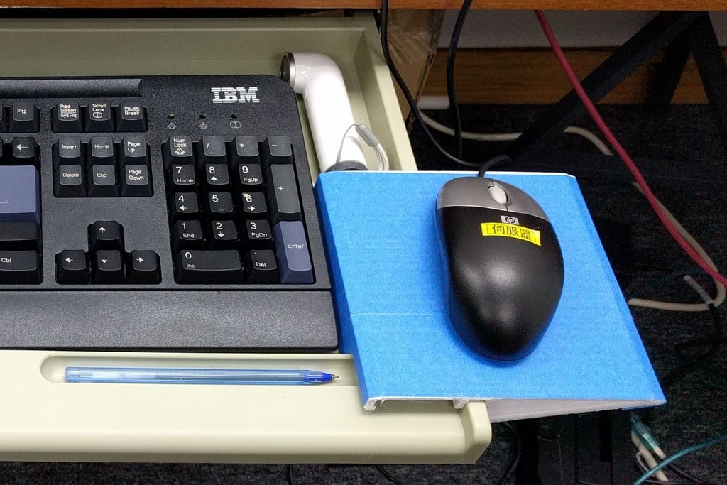 Mouse mat holder for keyboard drawer under the table