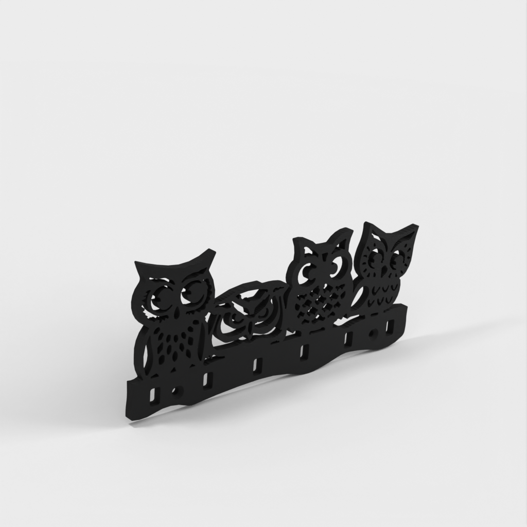 Wall-mounted key holder with owls