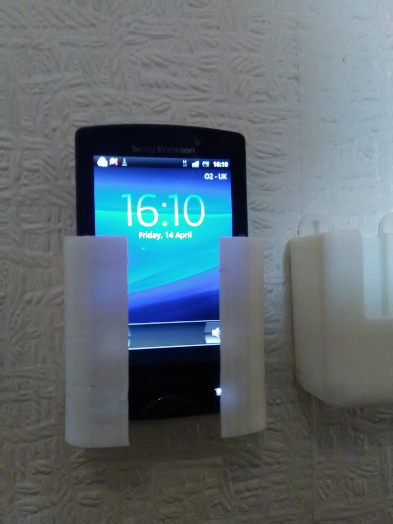 Remote control holder for mounting with Command Strips