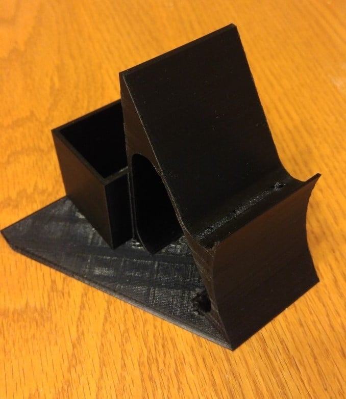 Holder for game controllers and remote control