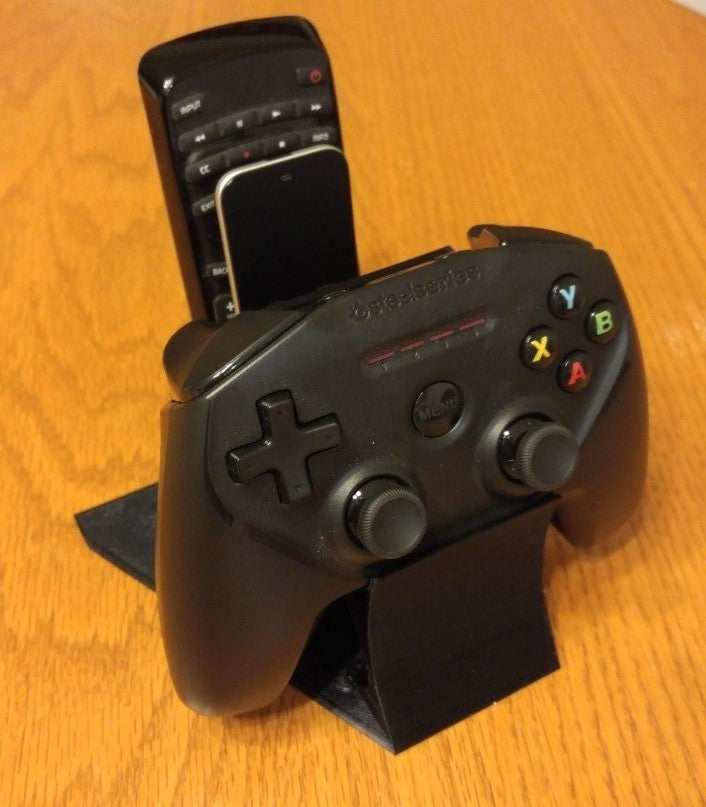 Holder for game controllers and remote control