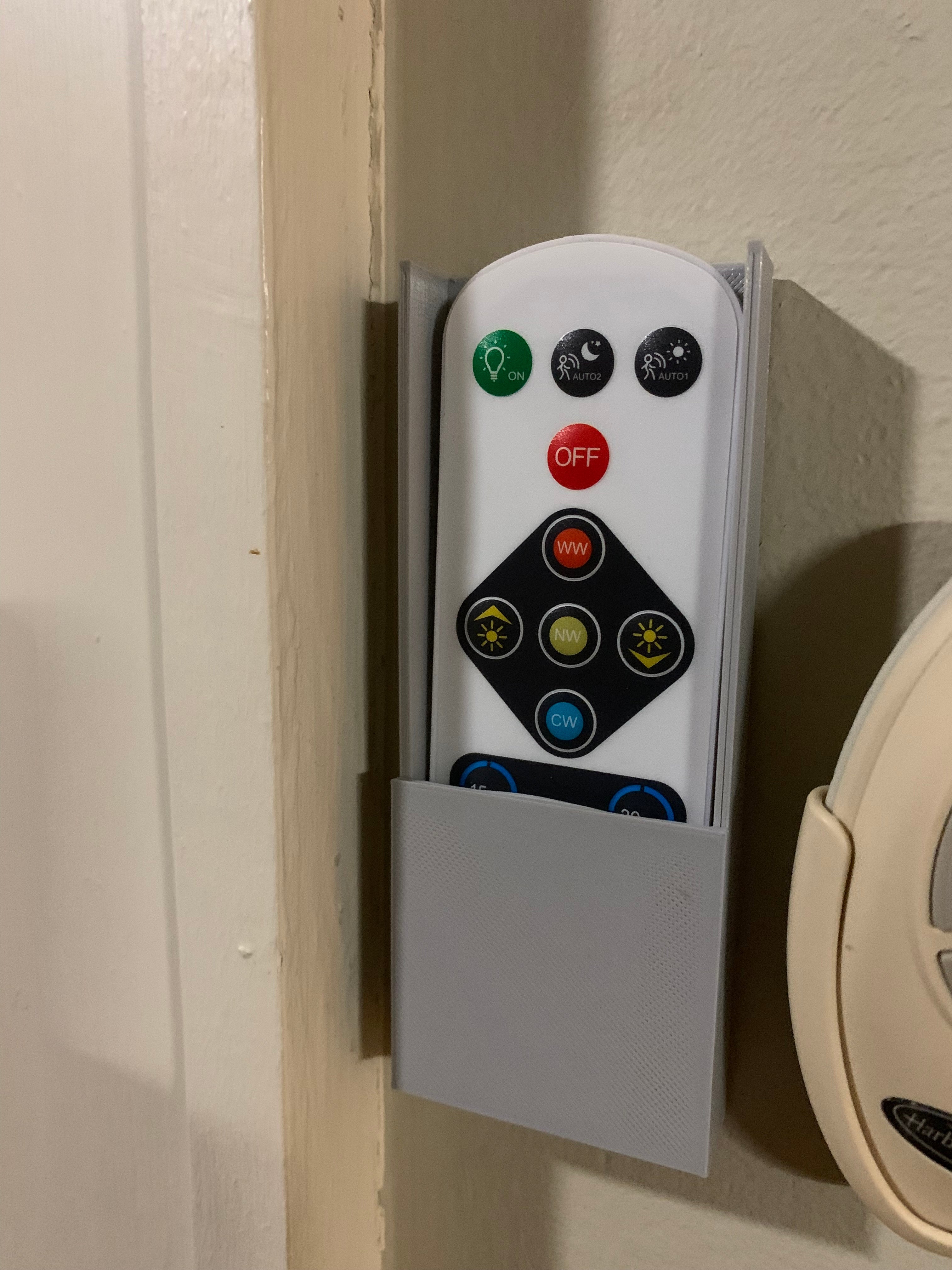 Wall-mounted remote control holder
