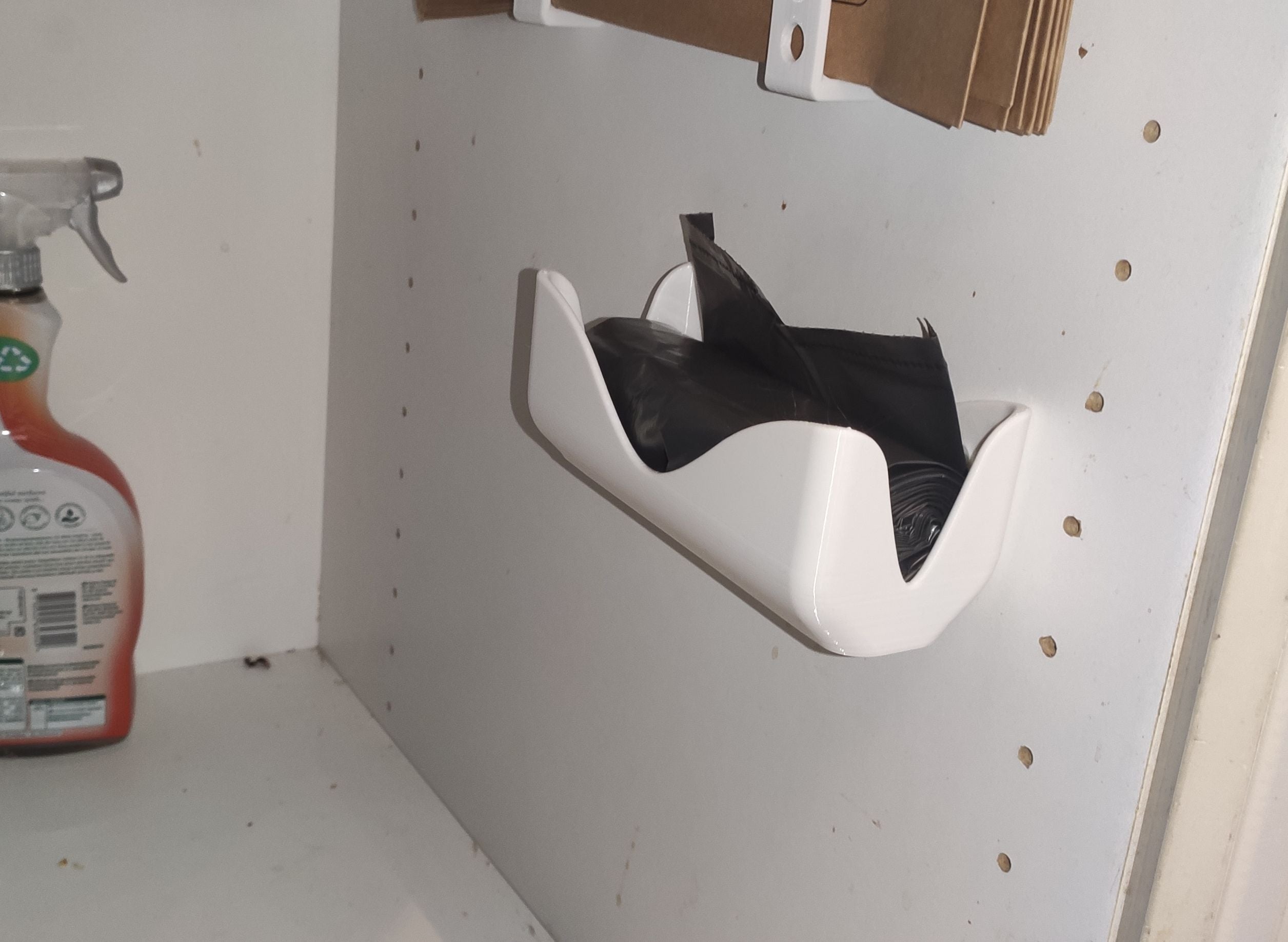 Wall-mounted bin bag holder
