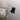 Wall-mounted power cord holder