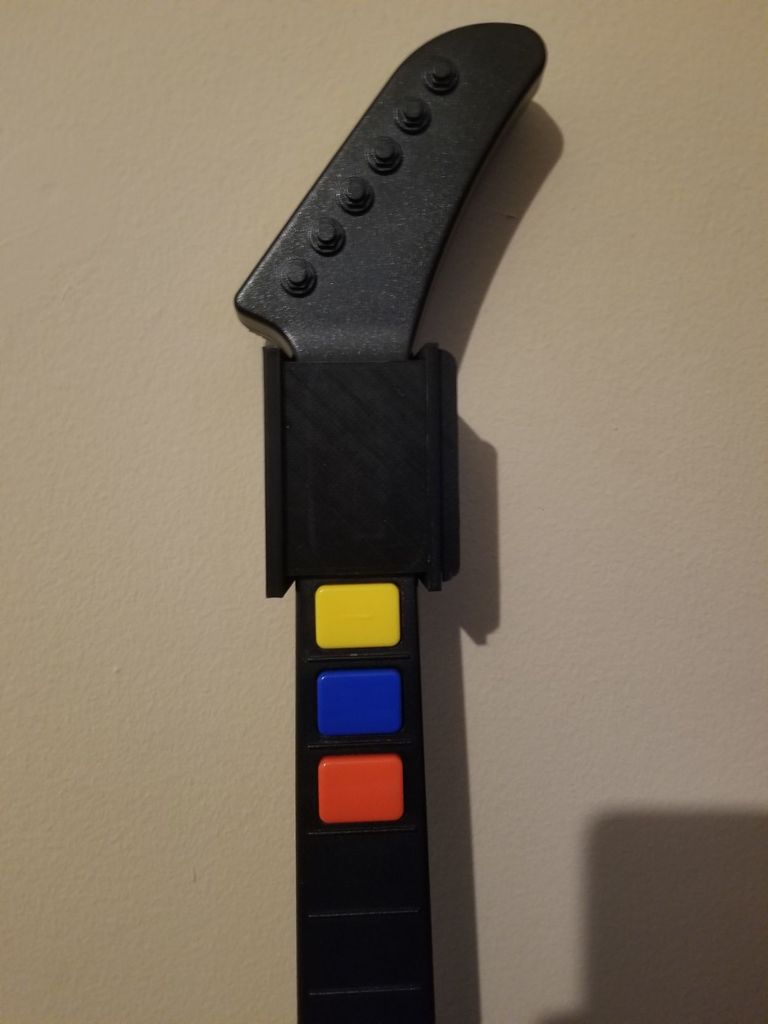 Wall hanger for Guitar Hero Xplorer V2