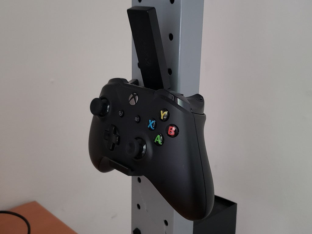 Xbox One wall mount with screw holes and USB slot for receiver