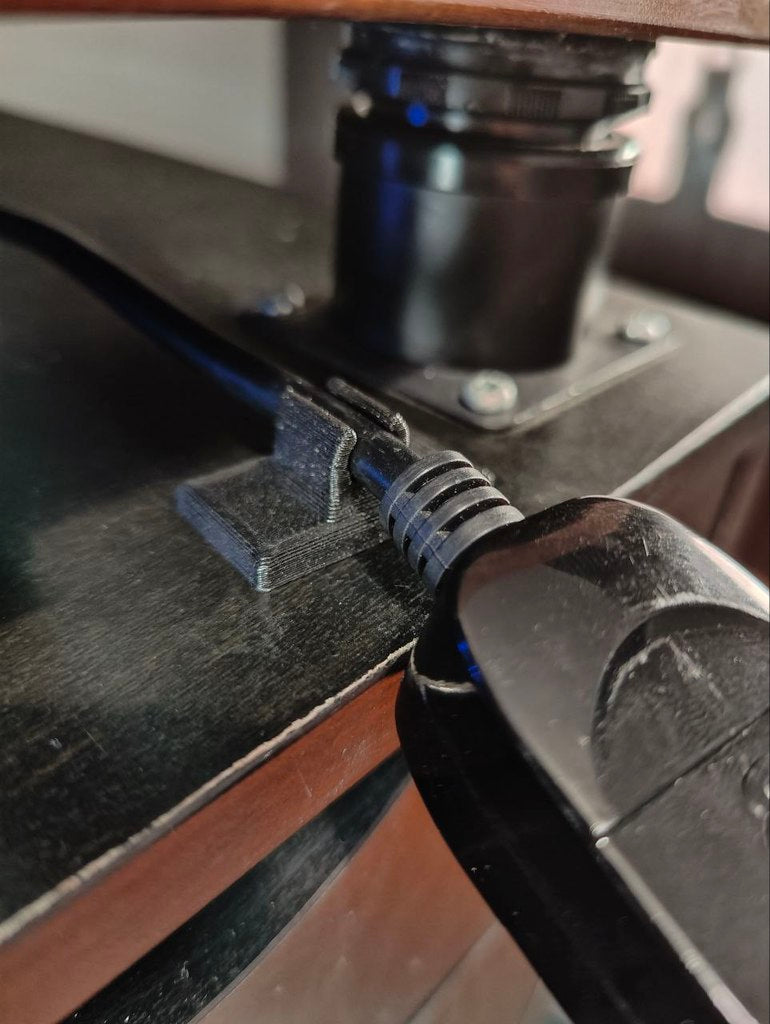 Cable clamp with double-sided adhesive tape