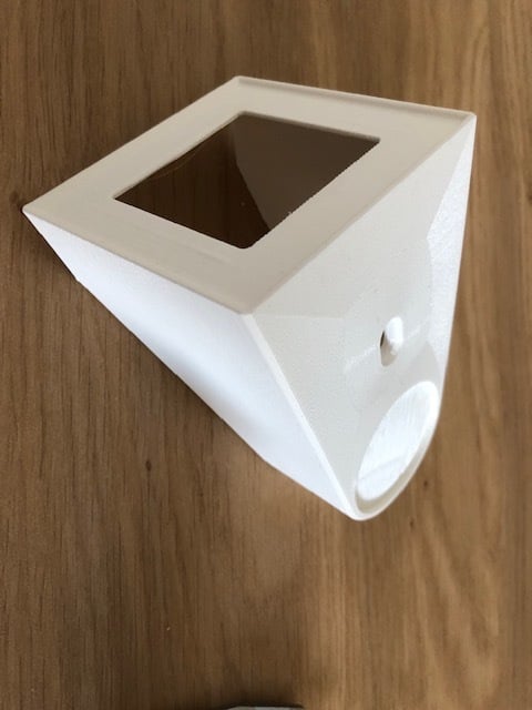 Wall mount for HomePod Mini at the socket
