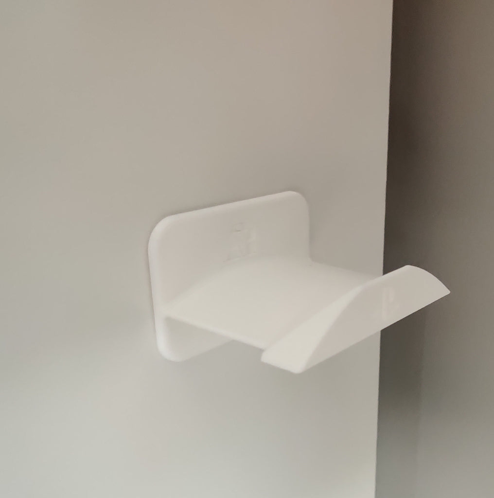 Wall-mounted headphone holder