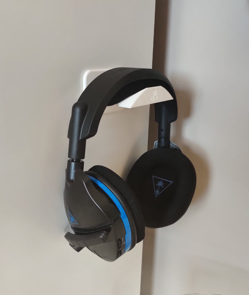 Wall-mounted headphone holder