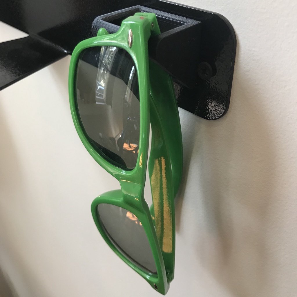 Wall-mounted holder for glasses and sunglasses