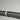 Wall-mounted holder for 2-inch vacuum hose