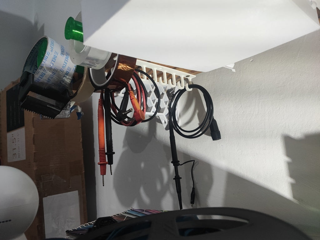Under shelf cable holder / hook