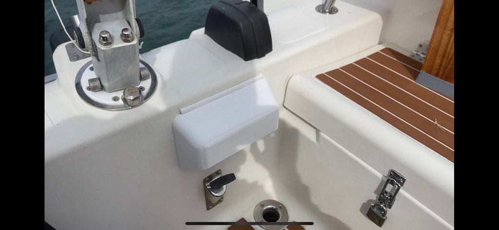 Cover with hinge for panel on boat engine