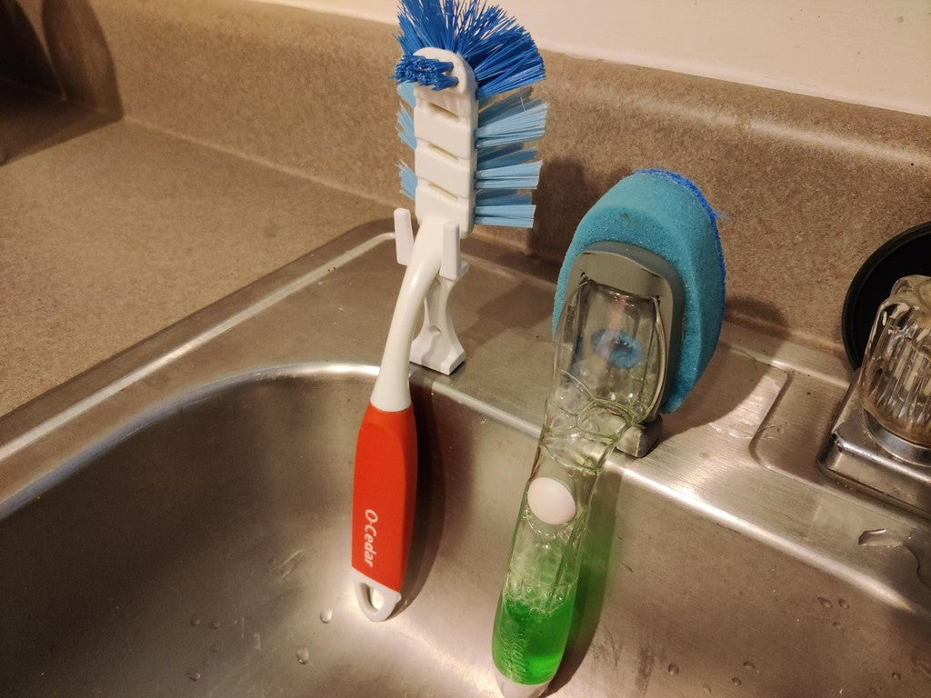 Dish brush holder with soap dispenser for the kitchen sink