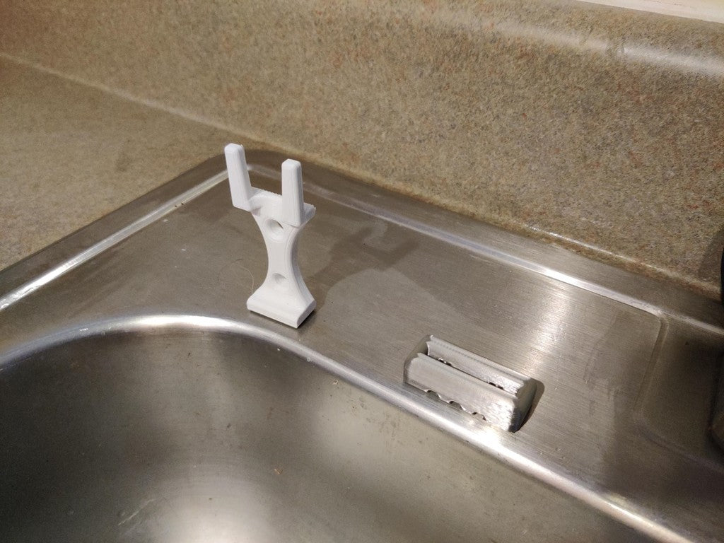 Dish brush holder with soap dispenser for the kitchen sink
