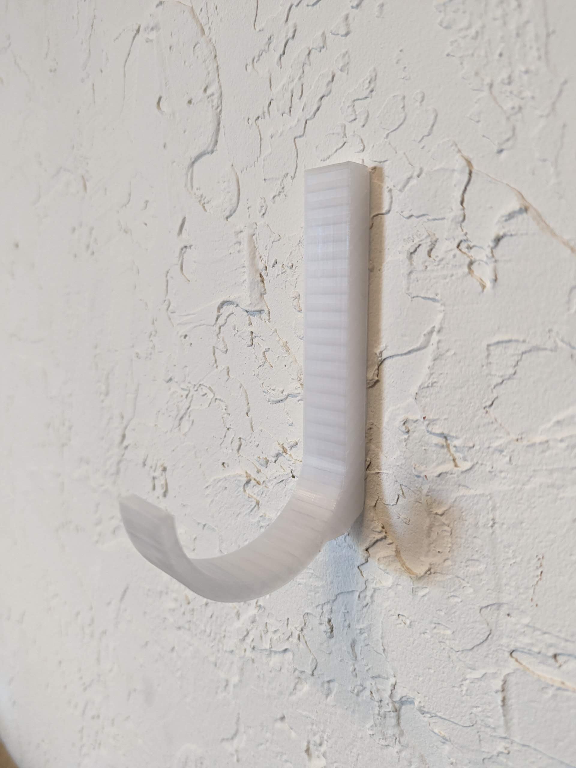 Wall hook for hanging umbrellas