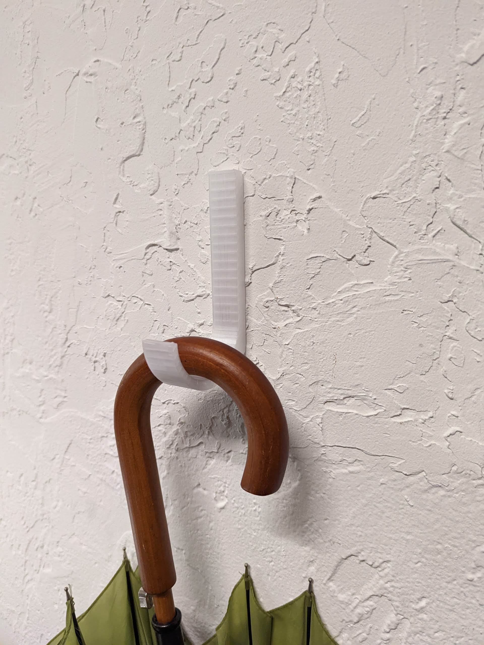 Wall hook for hanging umbrellas