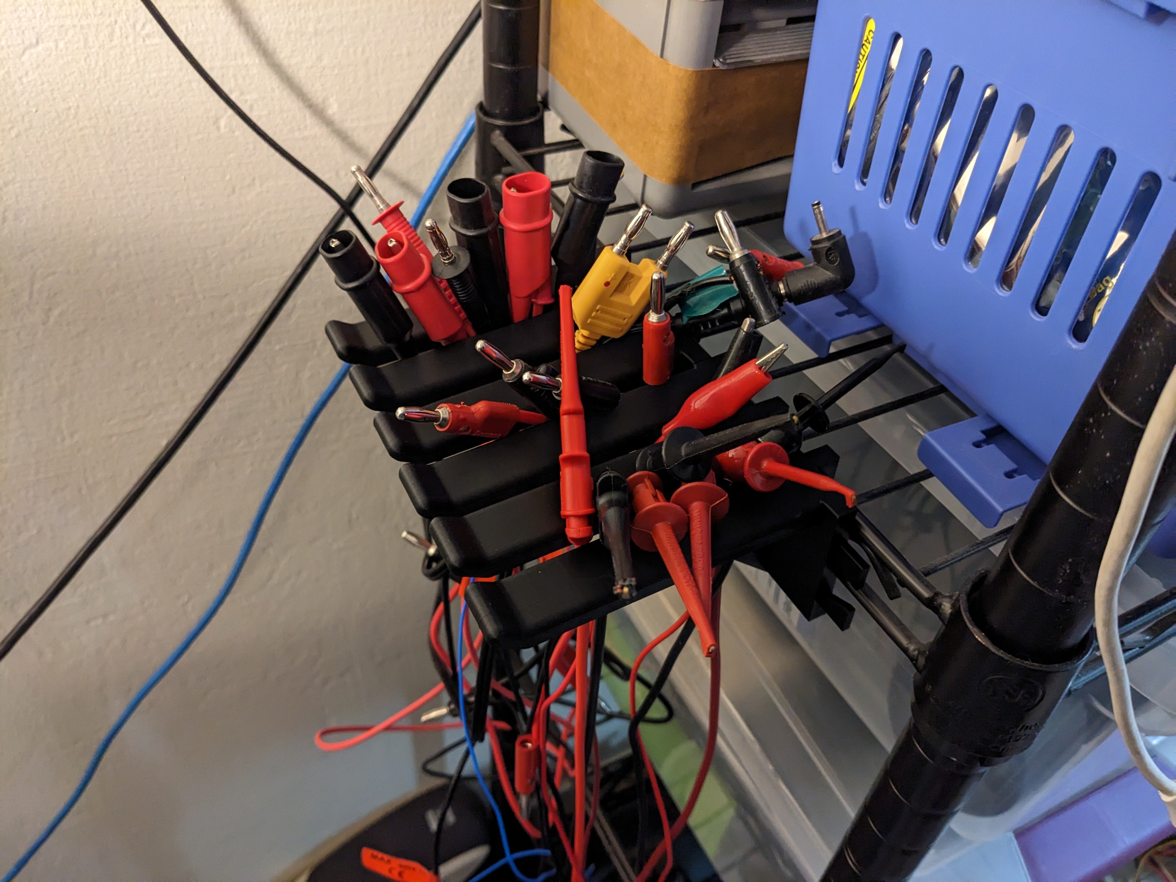 Test lead and cable hanger for HDX wire shelves
