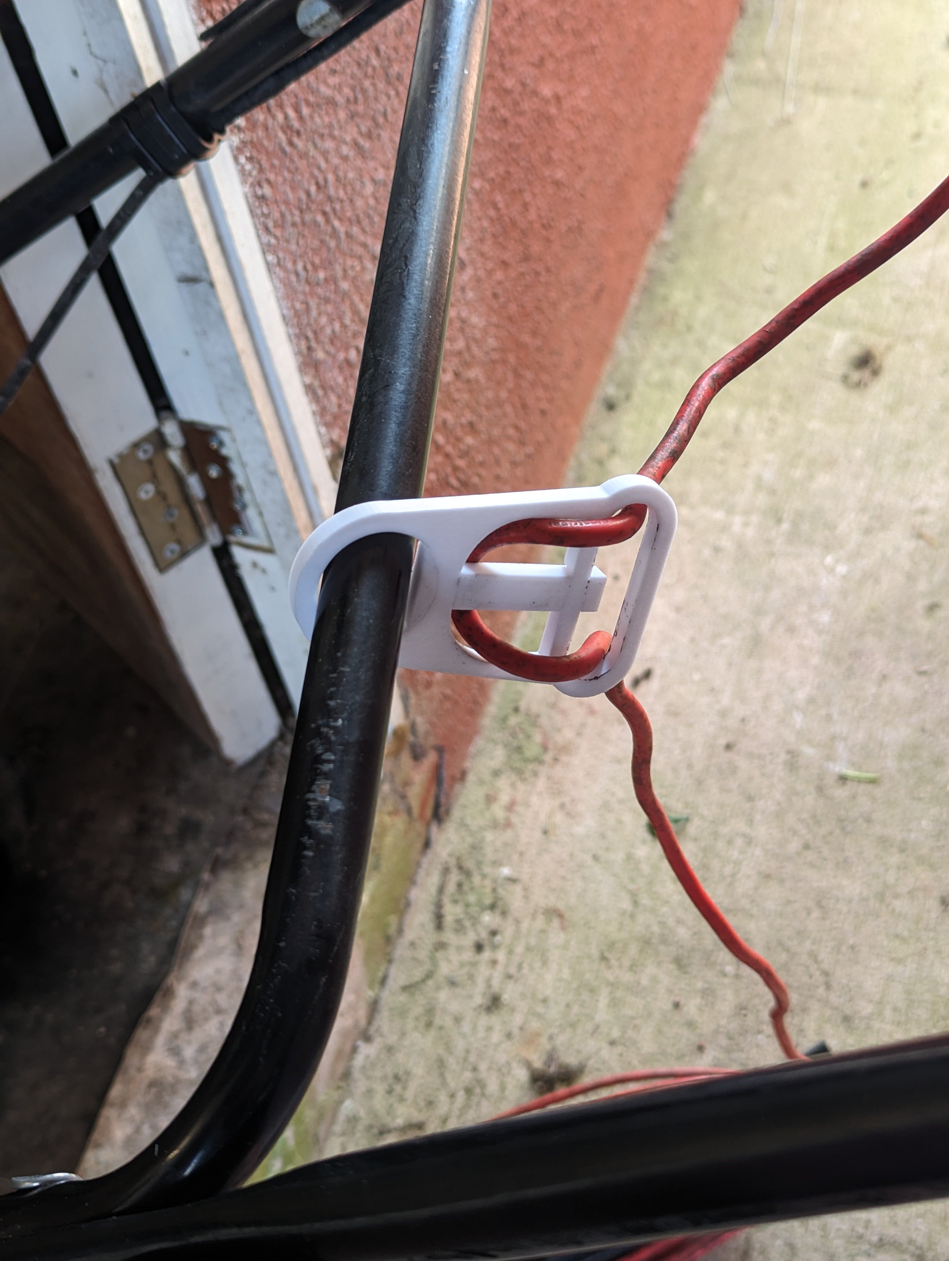 Cable holder for electric lawn mower