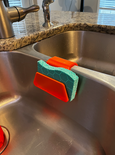 Sponge holder for kitchen sink