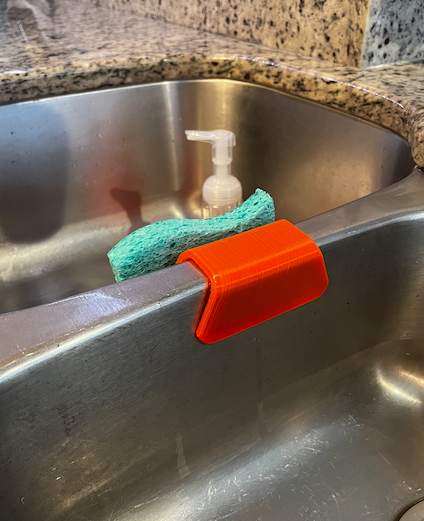 Sponge holder for kitchen sink