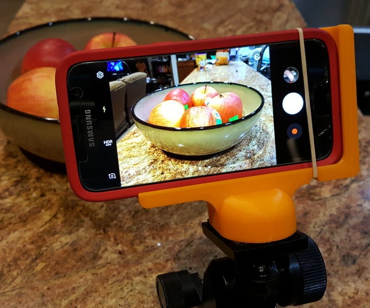 Phone holder for camera stands