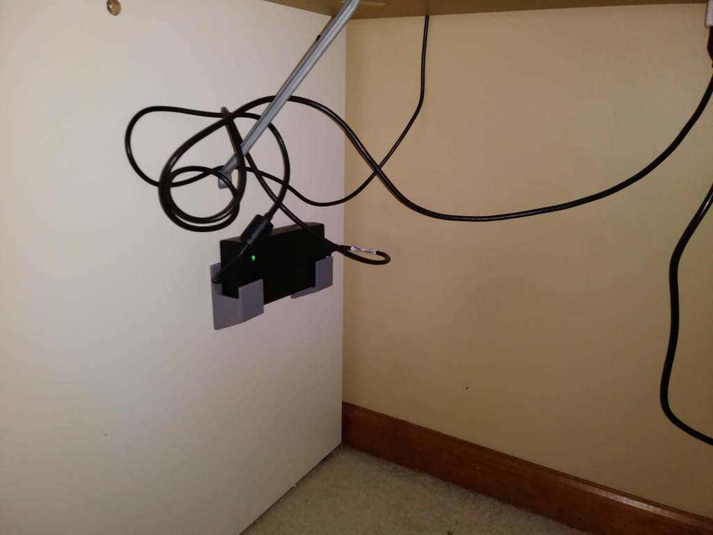 Wall bracket for power adapter