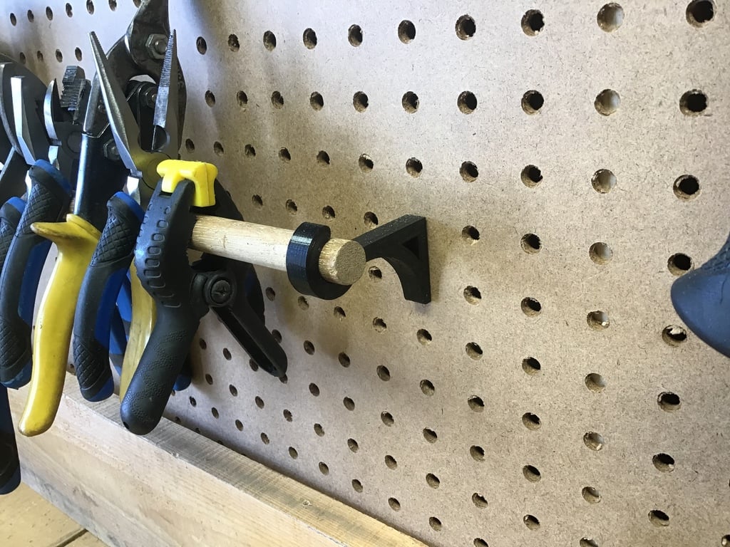 Several clamps and brackets for 1/4 inch Pegboard