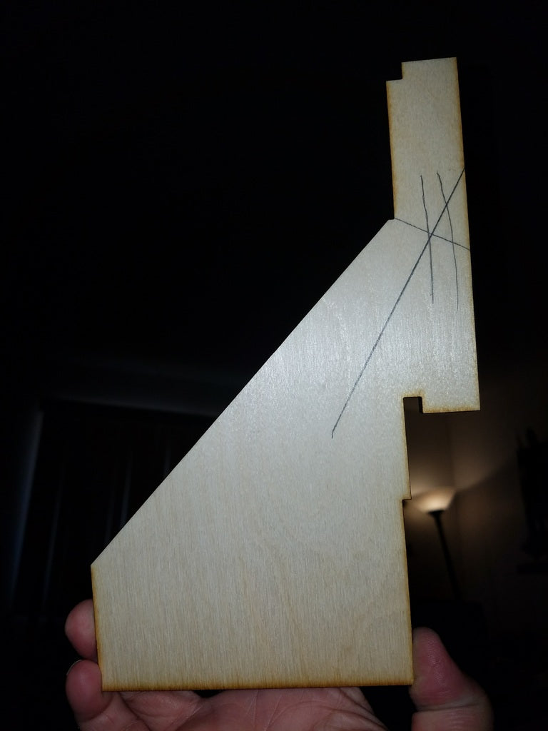 Parametric angled edge drilling jig for rocket removal