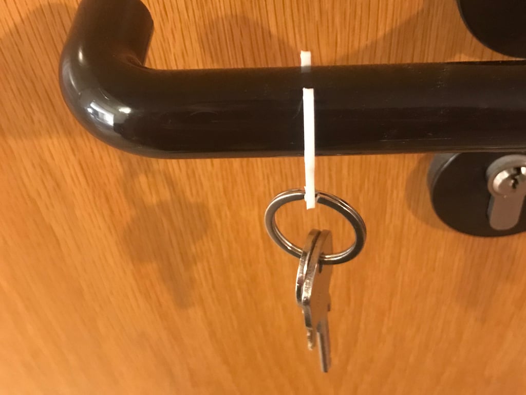 Key clip and shopping cart token for Door handle