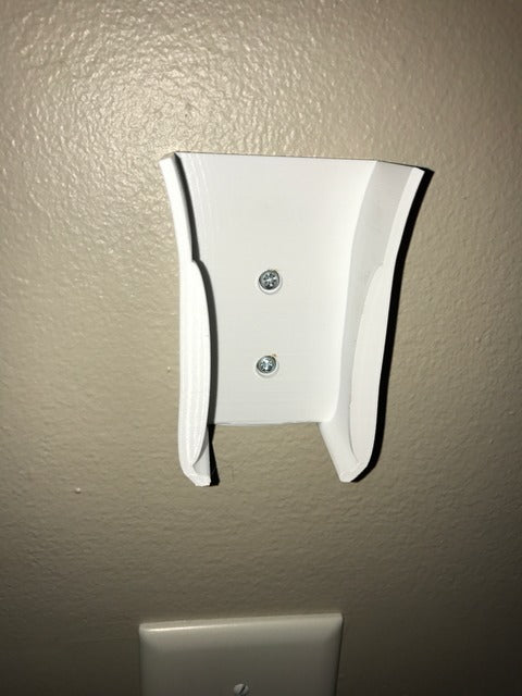 Wall-mounted holder for ceiling fan remote control