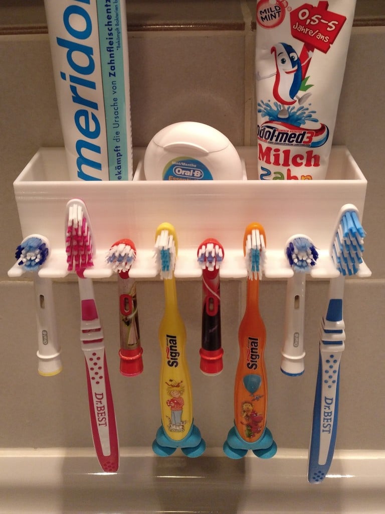 Wall-mountable bathroom organizer for toothbrushes and toothpaste